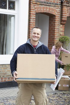 Customer moving boxes safely inside Kentishtown Storage facility